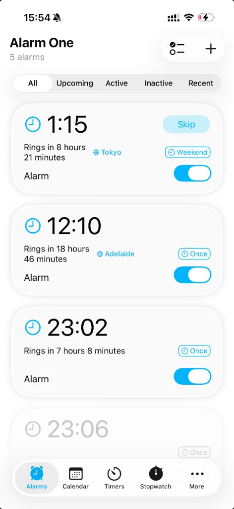 Alarm One app showing multiple alarms with time zones, one-time alarms, and skip controls